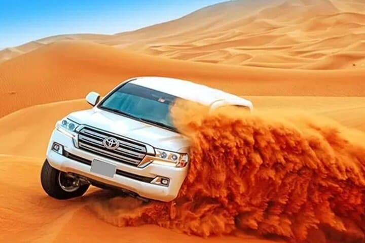 Dubai Desert Safari: Dune Bashing, Sandboarding & Sunset BBQ