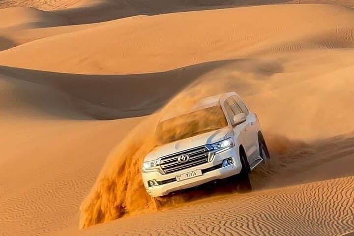 Dubai Desert Safari: Dune Bashing, Camel Ride & Live Dinner Show