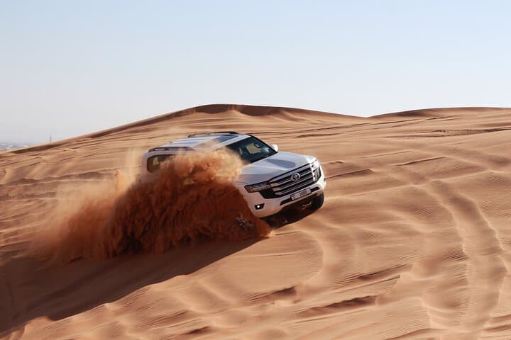 Dubai Red Dune Sunset Safari — Sandboarding, Dune Bashing & Camel Ride Experience photo 5