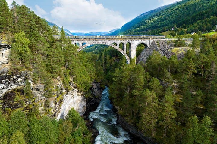 The Golden Train: Rauma Railway Through Romsdalen’s Trollveggen and Kylling Bridge