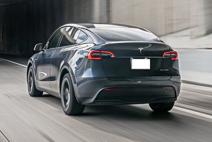 Eco Sedan Private Transfer DWC to Dubai by Tesla photo 4