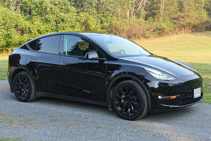 Eco Sedan Private Transfer DWC to Dubai by Tesla photo 5