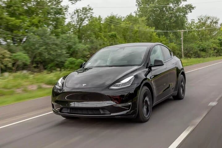 Eco Sedan Private Transfer DWC to Dubai by Tesla
