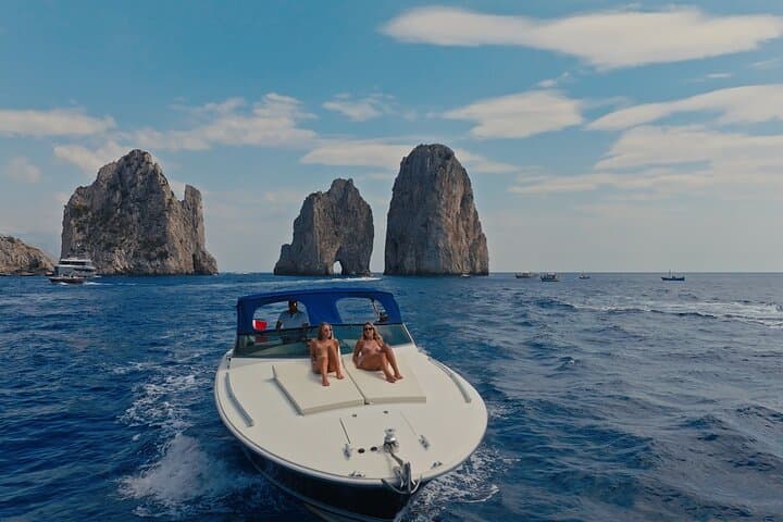 Capri Private Luxury Boat Tour — Faraglioni, Blue Grotto & Secret Coves