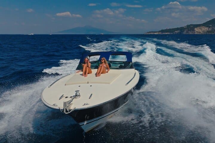 Capri Private Luxury Boat Tour — Faraglioni, Blue Grotto & Secret Coves photo 6