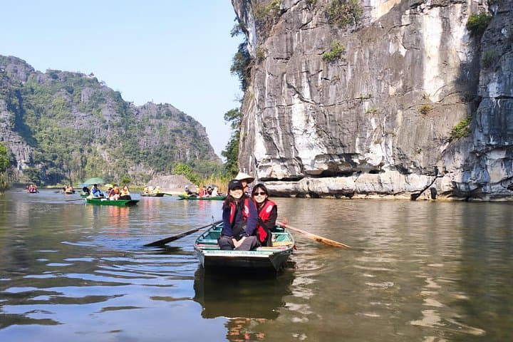 Tam Coc & Hoa Lu Private Day Tour: Sampan Boat Ride, Countryside Biking & Local Family Visit photo 1