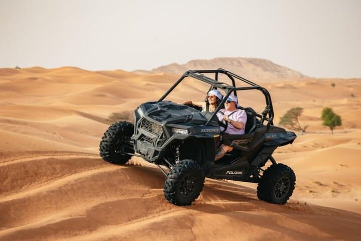 Drive the Red Dunes: 1-Hour Polaris Buggy Adventure with Camel Ride & Sandboarding photo 2