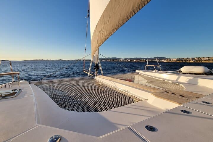 Private Half-Day Catamaran Cruise from Lagos: Caves, SUPs & Secluded Beaches