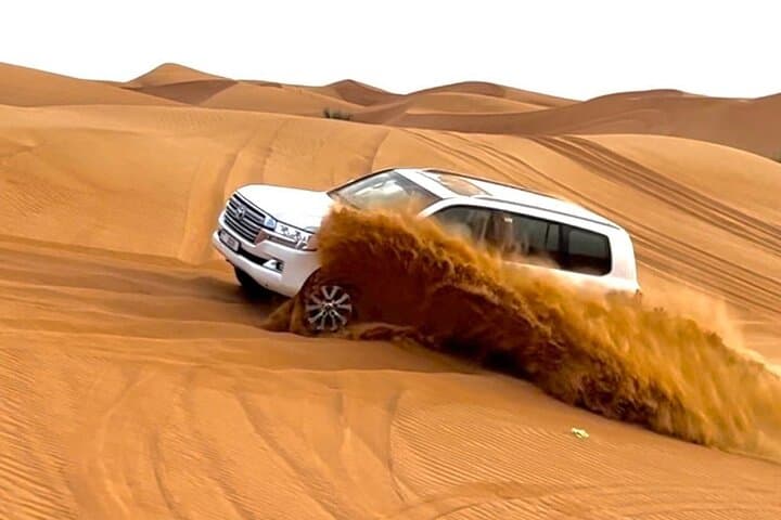 Dubai Evening Desert Safari: Sunset Dune Bashing, BBQ Dinner & Camel Ride