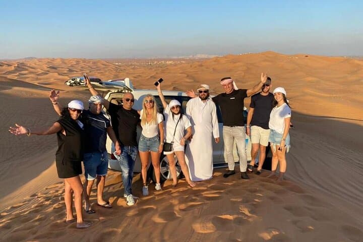 Evening Dubai Red Desert Safari: Dune Bashing, Camel Ride & Bedouin Dinner