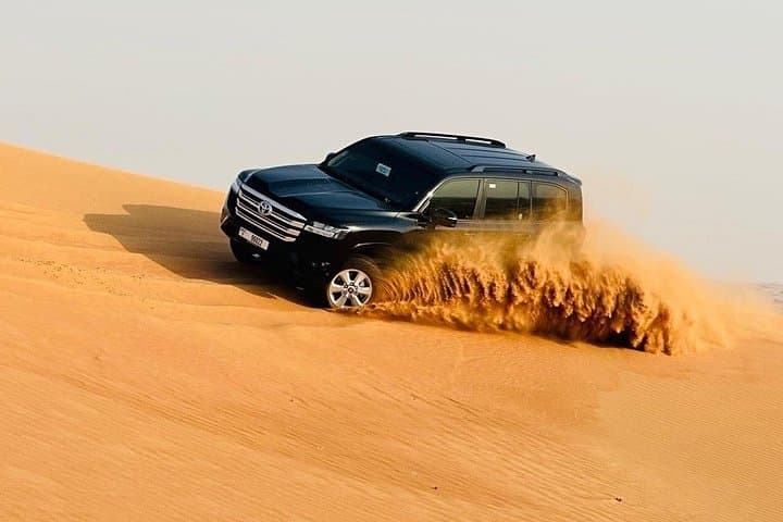 Dubai VIP Evening Desert Safari: Dune Bashing, Camel Rides & BBQ Under Desert Skies photo 1