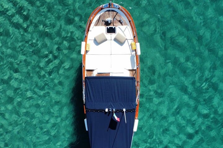 Circumnavigate Ischia on a Gozzo Aprea: Private Full-Day Cruise and Snorkel