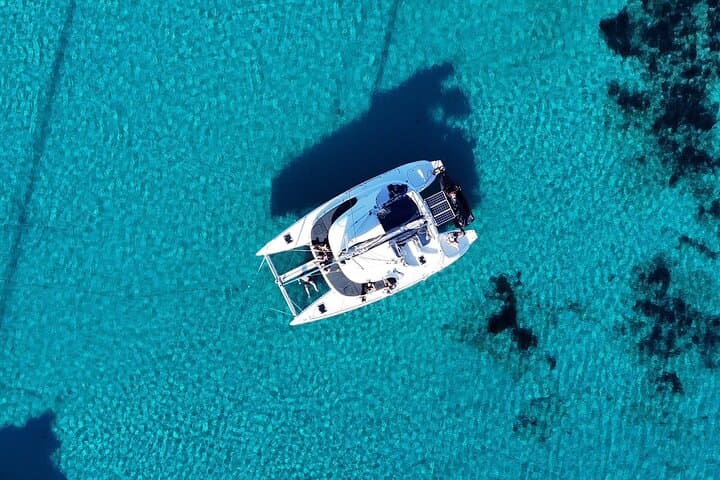 Sunlit Catamaran Cruise from Mykonos: Delos, Rhenia & Water Toys photo 3