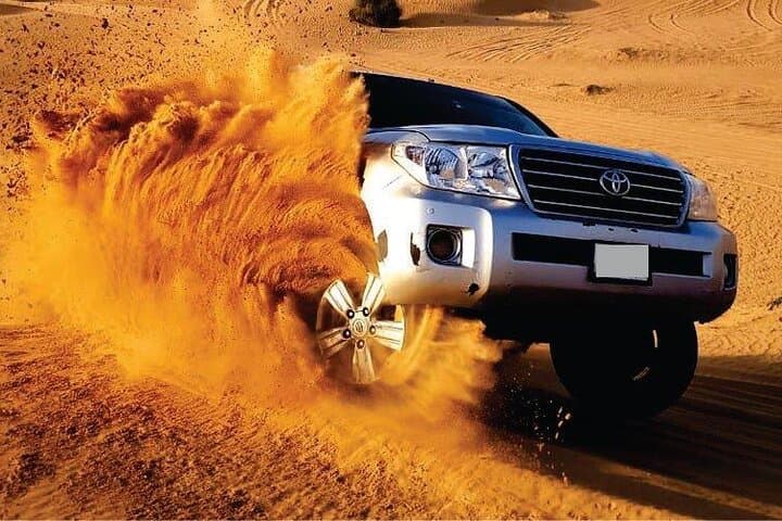 Morning Red Dune Safari: Camel Ride, Sandboarding & Dune Bashing in Dubai