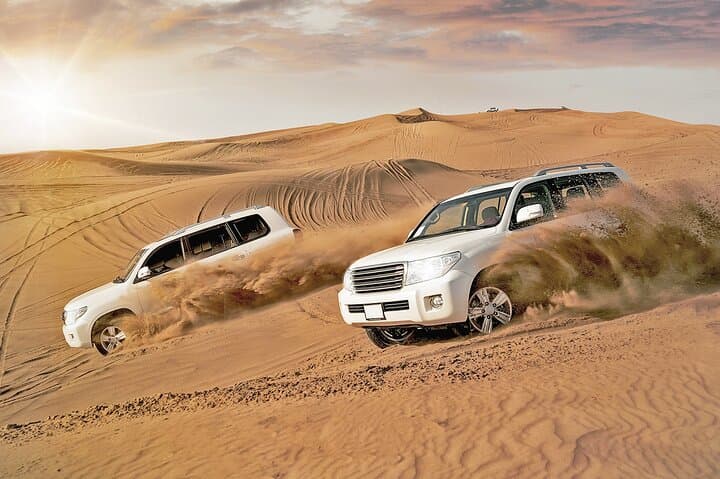 Dubai Desert Dune Bashing: Sandboarding, Camel Rides & Evening Bedouin Camp