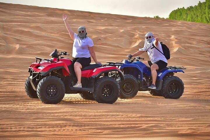 Dubai Desert Safari: Quad Bike, Sandboarding, Camel Ride & BBQ Experience