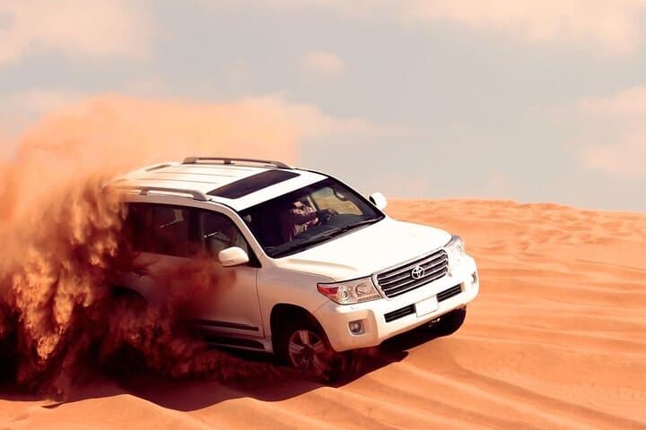 Dubai Morning Desert Safari in Lahbab: Dune Bashing, Sandboarding & Camel Ride