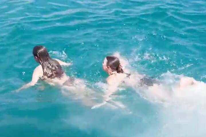 Side Dolphin Island Boat Tour — Swim, Snorkel & Foam Party (6-Hour) photo 5