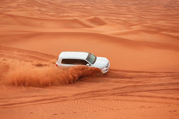Dubai Evening Desert Safari: Dune Bashing, Sandboarding & Bedouin Dinner
