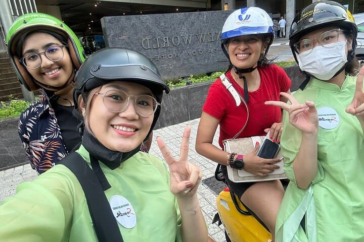 Scooter Through Saigon: Afternoon Historical Tour with Ao Dai Riders photo 4
