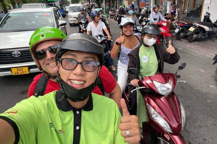 Scooter Through Saigon: Afternoon Historical Tour with Ao Dai Riders photo 6