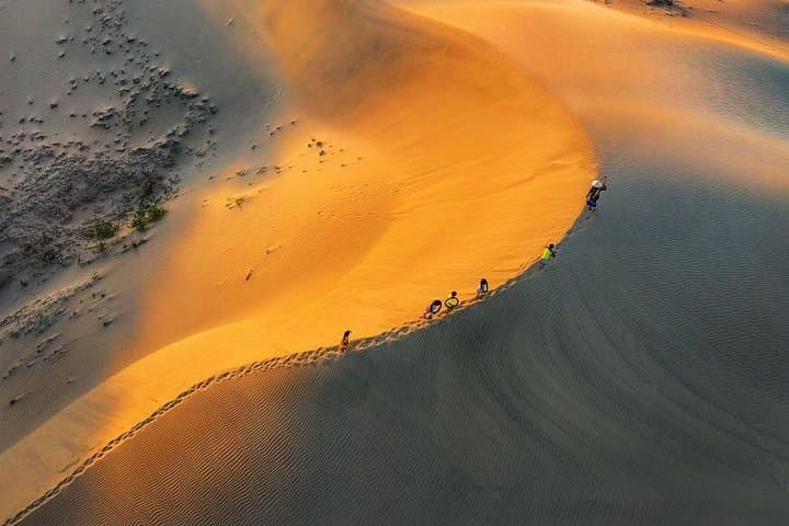 Mui Ne Sunset Tour from Ho Chi Minh: Fairy Stream, White & Red Sand Dunes photo 1