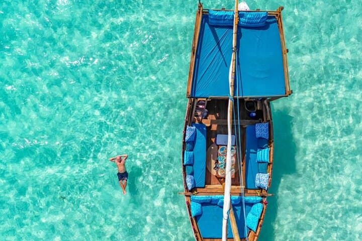 Luxury Mnemba Island Dhow Day Trip from Kendwa — Snorkel, Dolphins & Swahili Lunch