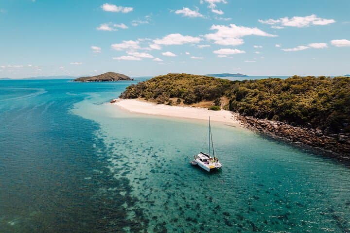 Great Keppel Catamaran Cruise: Snorkel, SUP & Secluded Beaches from Yeppoon