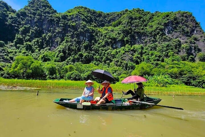 Ninh Binh Excursion: Tam Coc Boat Ride, Mua Cave Climb, Biking & Sunset Party from Hanoi