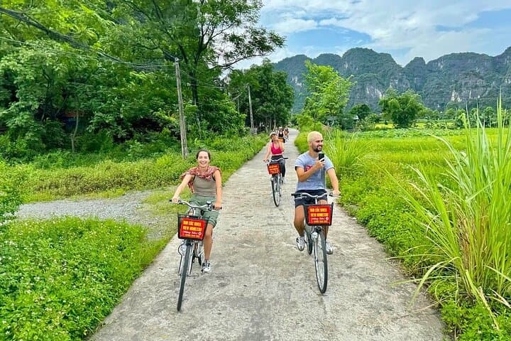 Ninh Binh Excursion: Tam Coc Boat Ride, Mua Cave Climb, Biking & Sunset Party from Hanoi photo 5