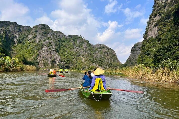 Full-Day Hoa Lu, Tam Coc & Mua Caves Tour from Hanoi — Boat, Bike & Mountain Views photo 6
