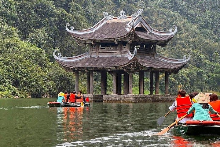 Explore Trang An and Hoa Lu: Full-Day Cycling, Boat Trip & Local Family Experience from Hanoi photo 1