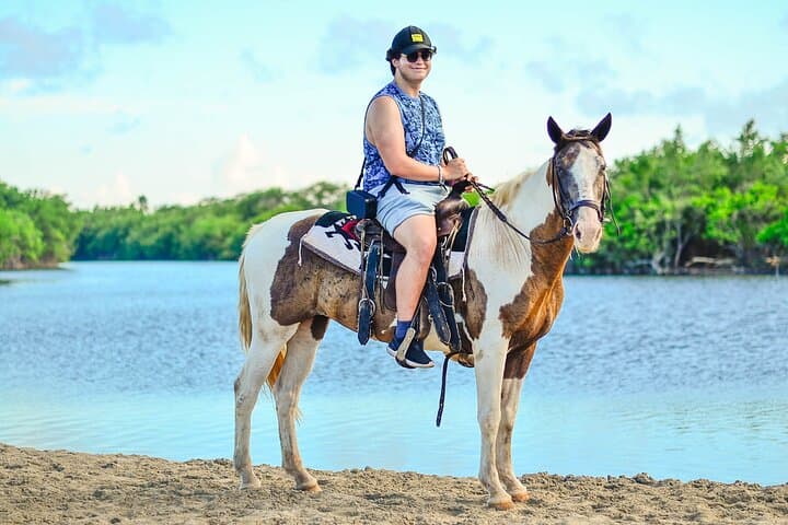 Unbridled Adventures: Horseback Riding on Macao Beach photo 2