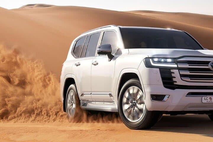 Evening Dubai Desert Safari: Dune Bashing, Camel Rides & Live BBQ Experience