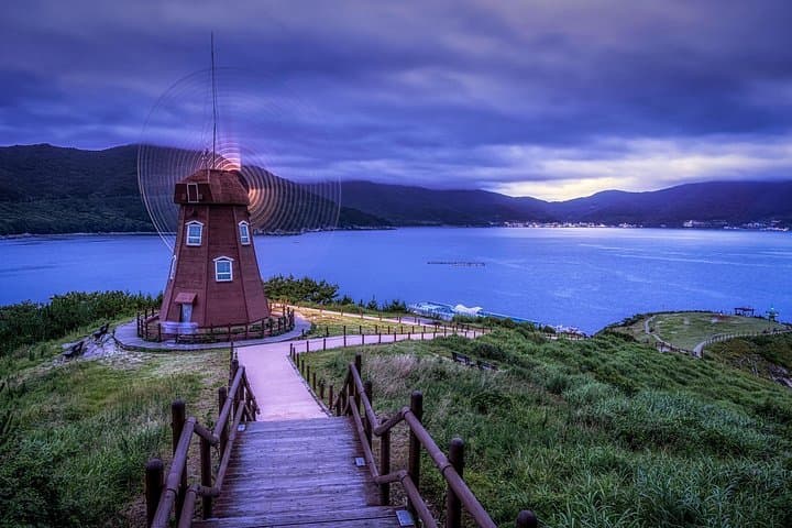 Busan to Geoje Seascapes & Windy Hills: Windmills, Pebble Beaches & POW History photo 1
