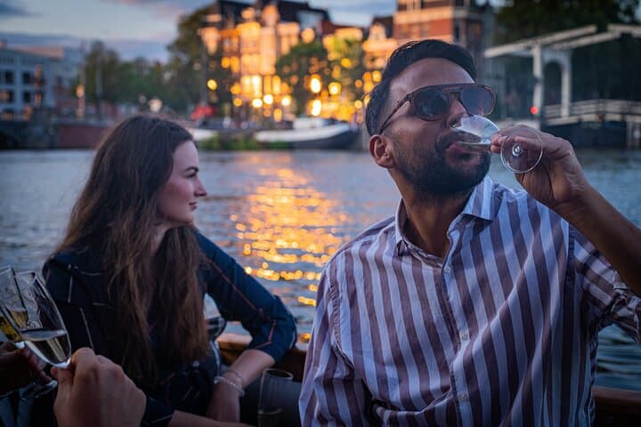 Romantic Private Amsterdam Canal Cruise 90-Min Evening Boat Tour with Welcome Drink