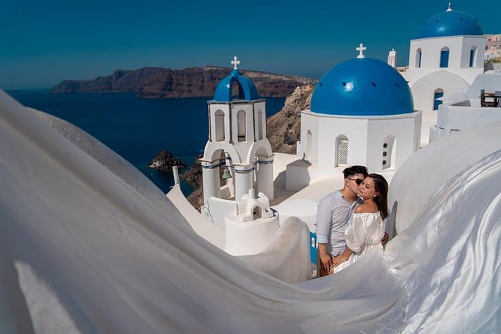 Flying Dress Photoshoot in Oia: Private Blue Dome Experience in Santorini photo 3