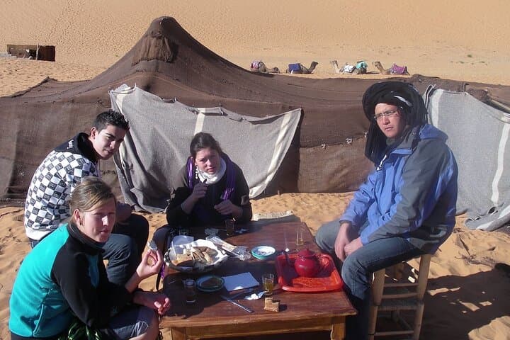 Overnight Camel Ride in Merzouga: Sunset Dunes, Berber Camp, and Sandboarding