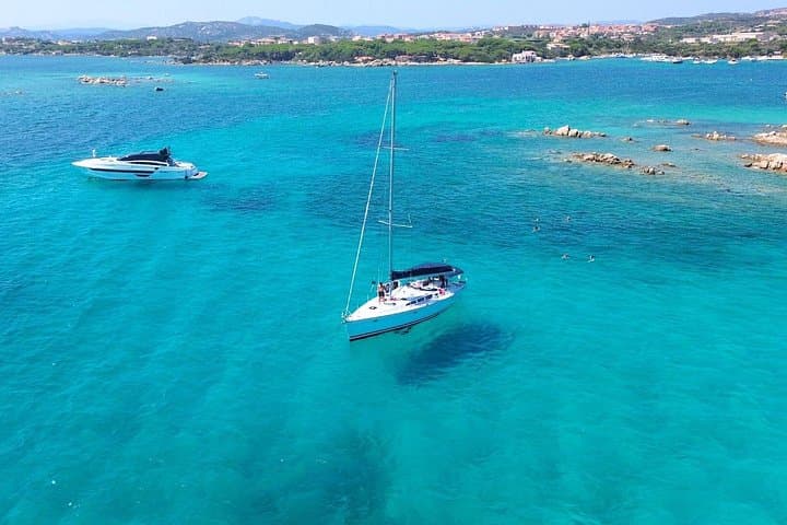 Sail the La Maddalena Archipelago from Cannigione — Full‑Day Sailboat Tour to Budelli, Spargi & Cala Corsara