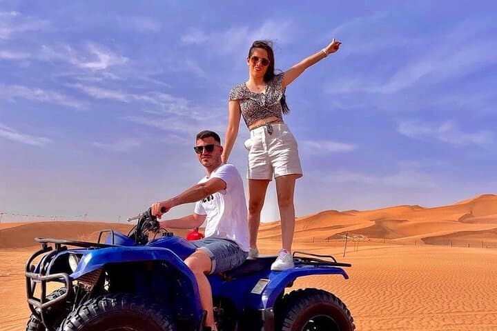 Morning Red Dunes Quad Safari in Dubai: Camel Ride & Sandboarding