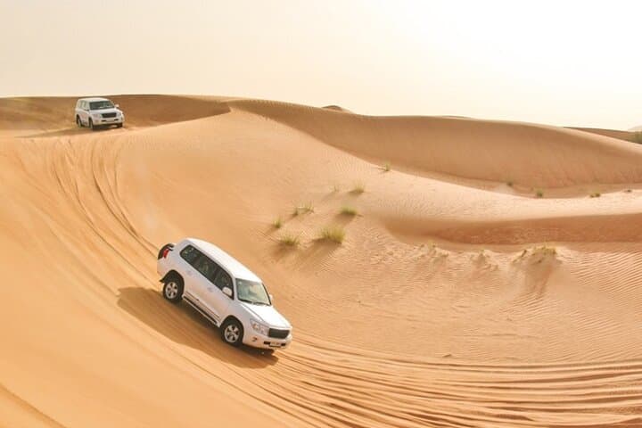 Sunset Dubai Desert Safari: Private 4x4 Dune Bashing, Camel Ride & BBQ Camp photo 2