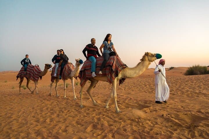 Sunset Dubai Desert Safari: Private 4x4 Dune Bashing, Camel Ride & BBQ Camp