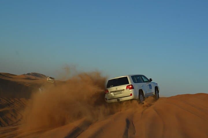 Sunset Dubai Desert Safari: Private 4x4 Dune Bashing, Camel Ride & BBQ Camp photo 4