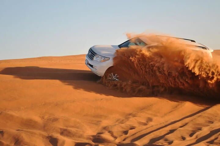 Dubai Desert Safari: Dune Bashing, Sandboarding & BBQ Evening
