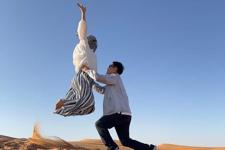 Private Morning Desert Safari: Sandboarding, Camel Ride & Dune Bashing in Dubai photo 2