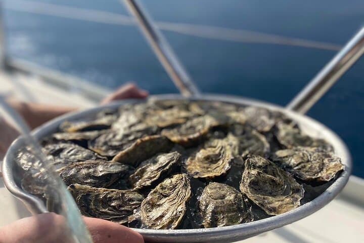 Sunset Sailing and Oysters off Sitges: Garraf Coast Evening Cruise