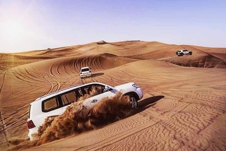 Morning Desert Safari Dubai: Camel Ride, Dune Bashing & Sandboarding