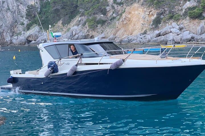 Capri Private Boat Tour: Circumnavigate Grottos, Faraglioni & Swim in Crystal Waters photo 1