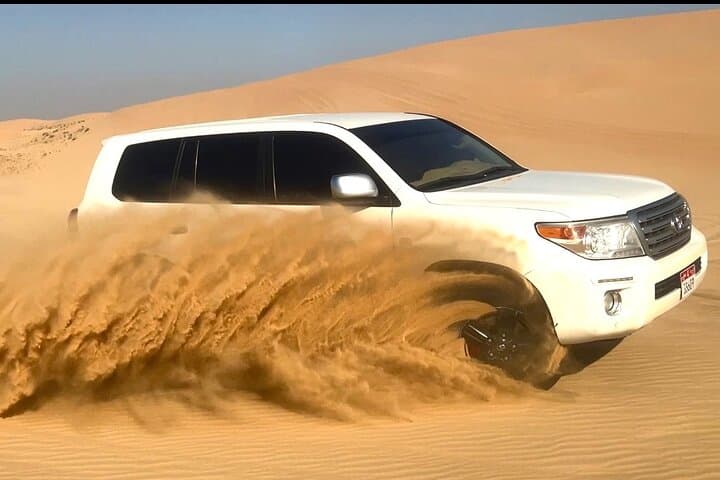 Private Abu Dhabi Sunset Desert Safari with Sandboarding: Dune Bashing & Camel Farm Visit photo 4