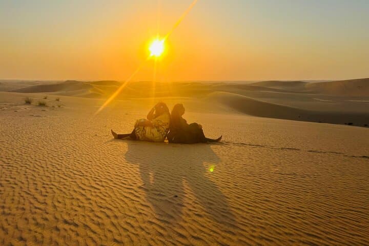 Private Abu Dhabi Sunset Desert Safari with Sandboarding: Dune Bashing & Camel Farm Visit